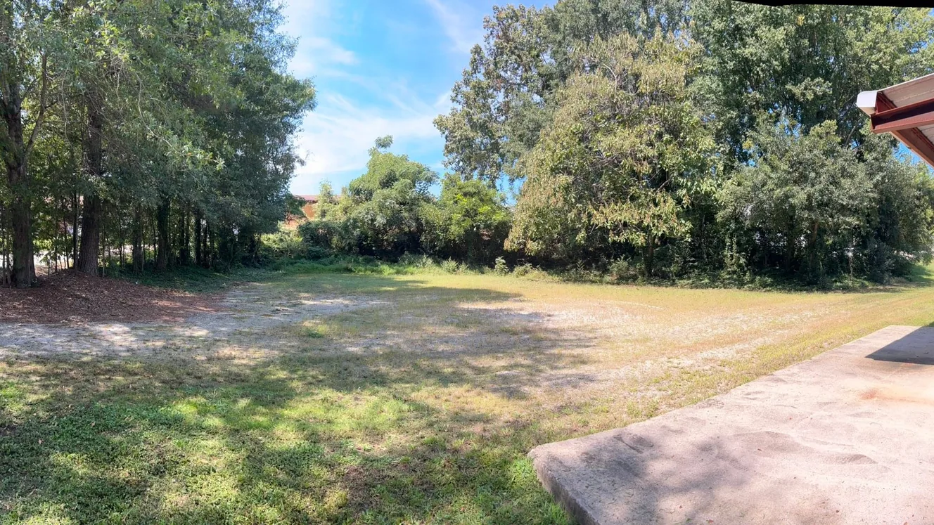 Open side lot cleared back to the tree line, land clearing