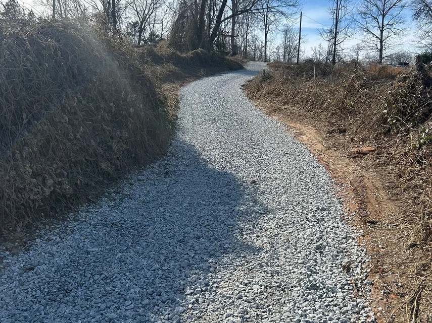 Gravel driveways: fresh gravel spread on a regraded drive